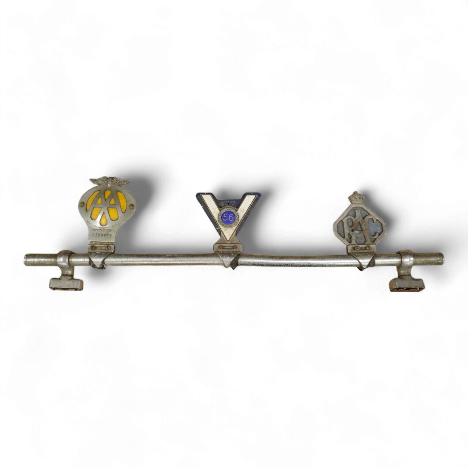 Three car badges to include RAC and AA, mounted on a bar, 67cm in length